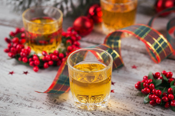 Whiskey, brandy or liquor shot and Christmas decorations