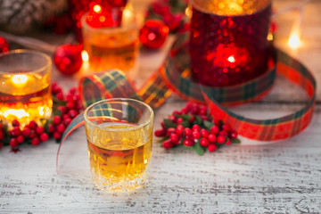 Whiskey, brandy or liquor shot and Christmas decorations