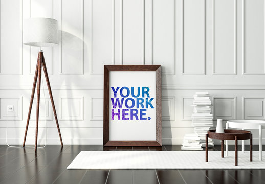 Wooden Framed Poster Leaning on White Wall Mockup