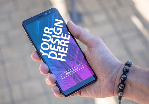 Smartphone in Hand Mockup