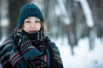 portrait of young woman in winter park