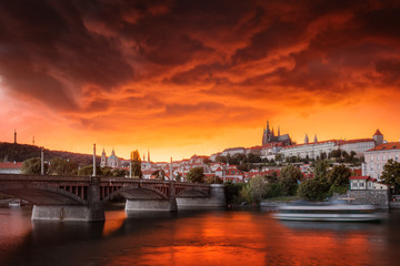 Fototapeta na wymiar Typical Prague panorama of castle and manes bridge in Czech Republic at the beautiful stormy sunset.