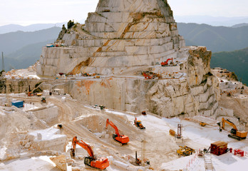 Carrara marble quarry, extraction and processing of precious white Statuario marble
