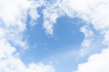 Puffy clouds up in the blue sky