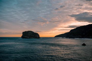 dawning in gaztelugatxe on an autumn day. Beautiful colors, perfect for a postcard. Basque Country,...