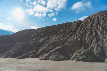 sand pit in the mountains, the mountains of sand, the trail from the tires of a large car