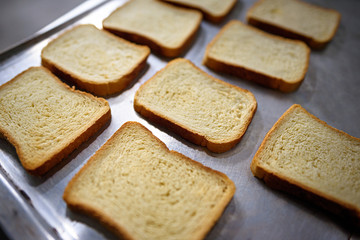 fresh sliced bread on metal surface, horizontal