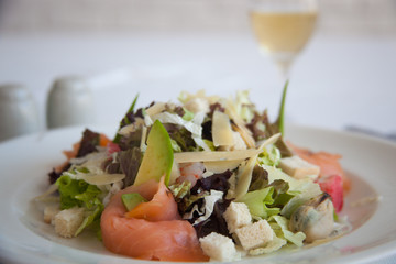 fresh salad with cheese,  seafood and avocado