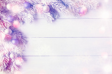New Year background with Christmas tree branches and Xmas balls.