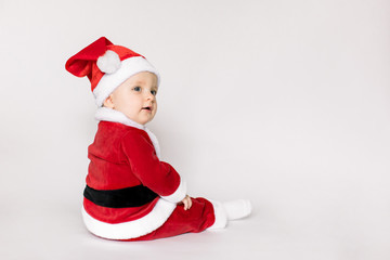 Happy baby girl celebrating Christmas isolated on white background