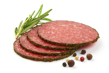 French salami slices with herbs and spices, isolated on a white background. Close-up