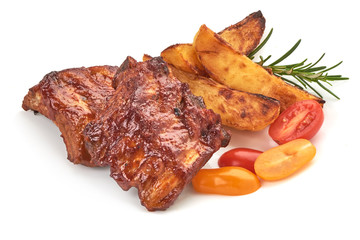 Barbecued and Marinated Sticky Spare Ribs with Potato Wedges, isolated on a white background. Close-up