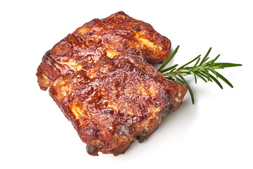 Roasted Pork Ribs with herbs, isolated on a white background. Close-up