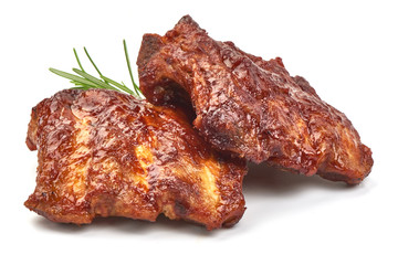 Delicious Grilled Ribs with herbs, isolated on a white background. Close-up