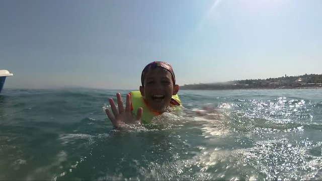 boy on pedal boat pulls off the hill into the sea, outdoors