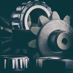 Gears, bearings and differential stars lie on the table close-up