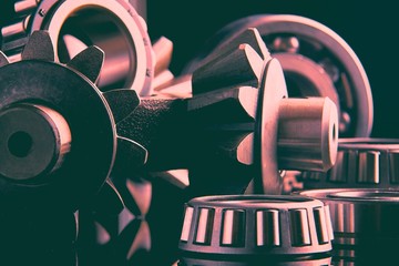 Gears, bearings and differential stars lie on the table close-up