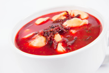 Traditional polish Christmas Eve dish: red borscht with uszka (a mushroom filled kind of dumplings)