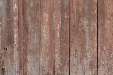 Background of wooden fence with scratches and spots of old paint. Abstract design element