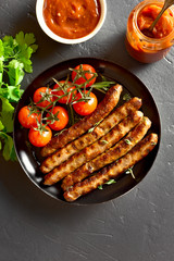 Fried sausage and cherry tomatoes