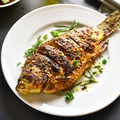 Roasted fish on plate