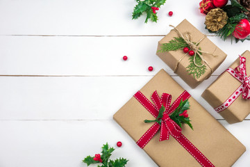 Christmas presents creative layout. White wood background whit copy space. Border arrangement. Flat...
