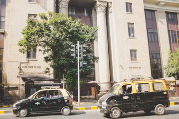 The Bank of India front of the building with taxis outside in Mumbai