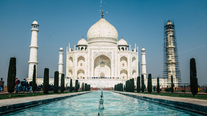 Fototapeta premium The Taj Mahal in Agra, India with scaffolding on one pillar