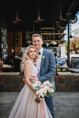Fototapeta premium Photo shoot of the newlyweds on the street. Kirov Avenue. Saratov.