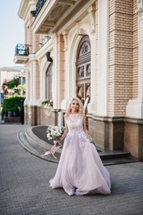 Fototapeta premium Photo shoot of the newlyweds on the street. Kirov Avenue. Saratov.