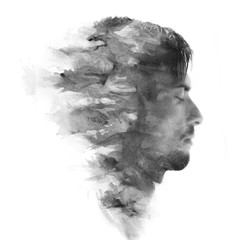 Paintography. Double exposure profile portrait of a young, attractive man combined with black and...