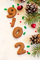 Christmas New year frame with gingerbread number cookies forming 2019