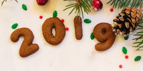 Christmas New year frame with gingerbread number cookies forming 2019