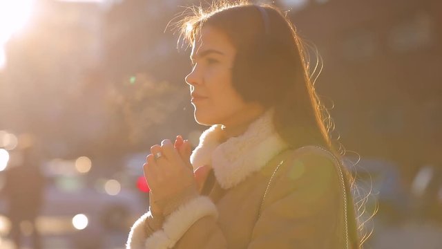 Outdoor woman portrait in cold winter city