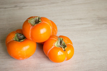 Fresh ripe persimmon, persimmon. Vitamins in the winter