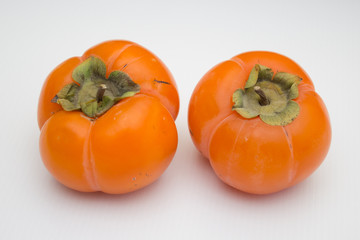 Fresh ripe persimmon, persimmon. Vitamins in the winter