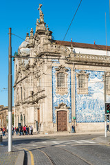 The side facade of Carmo Church is lined with a large panel of tiles, depicting scenes alluding to the foundation of the Carmelite Order