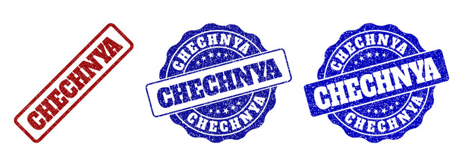 CHECHNYA scratched stamp seals in red and blue colors. Vector CHECHNYA labels with grunge texture. Graphic elements are rounded rectangles, rosettes, circles and text labels.