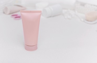 Baby cream on the background of other means of care for the newborn.