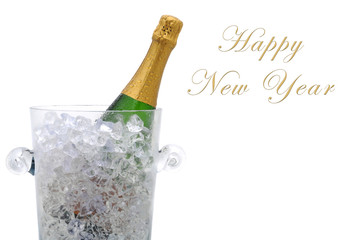 A champagne bottle in a cyrstal ice bucket with the words Happy New Year