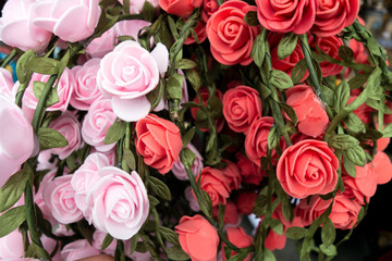 Handmade artificial roses for wreaths on Octoberfest in Munich, close-up.