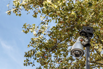 Surveillance and video recording camera placed on a metal pole
