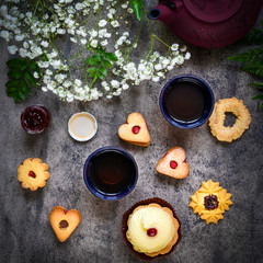 Fototapeta na wymiar Japanese teapot with cookies and flower