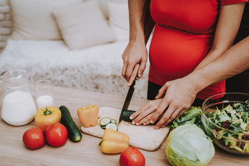 Couple is Cooking Salad from Fresh Vegetables