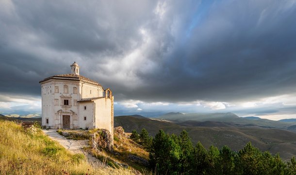 Church Santa Maria della Pieta with mountain massif Gran Sasso, Italy