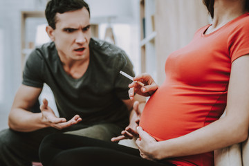 Man Argues with Pregnant Wife Who Smokes Cigarette