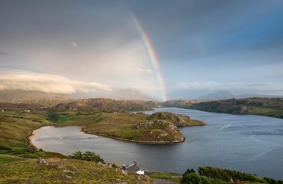 Light mood with rainbow over the sea inlet Loch Inchard, Kinlochbervie, Sutherland, North-West Highlands, Scotland, United Kingdom, Europe