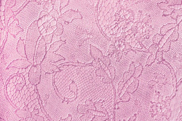 Texture of tender pink genuine leather close-up, with embossed floral trend pattern, wallpaper or...