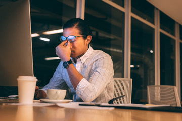 Entrepreneur working late night in office