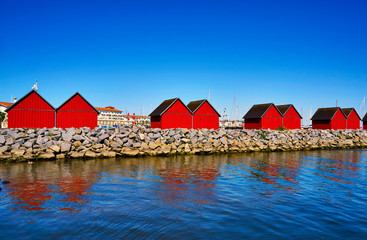 Eight red fisherman's houses in the harbor Weiße Wiek in Boltenhagen on the Baltic Sea. Germany